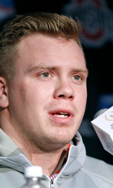 Leading men: Ohio St's Elflein, Clemson's Boulware show way